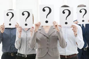 People holding question marks in front of faces