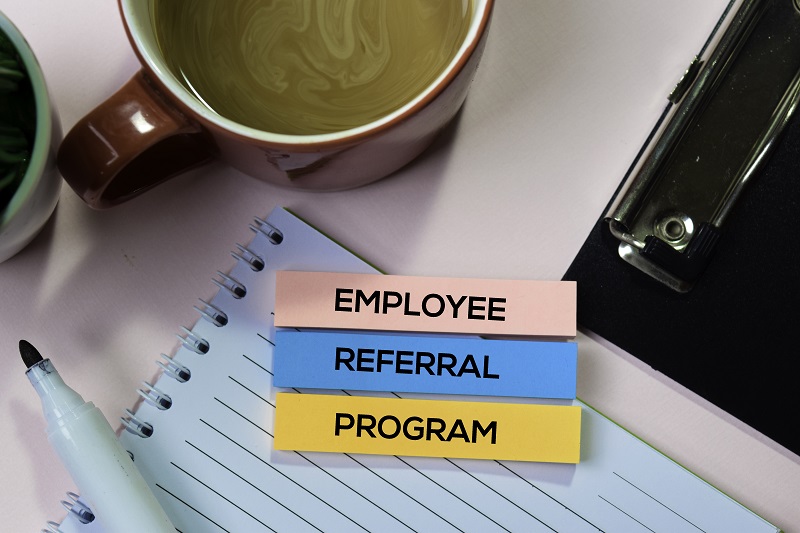 Employee Referral Program text on sticky notes 