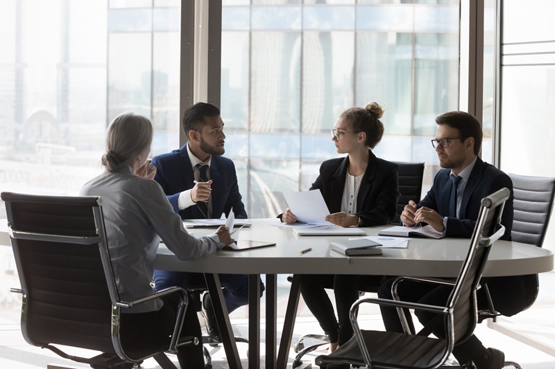 4 lawyers collaborating on a project in office